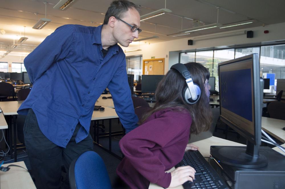 Professor Volker assisting a student